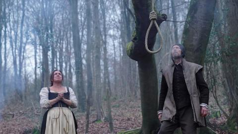 Dramatic reconstruction of Agnes Waterhouse looking up at a noose