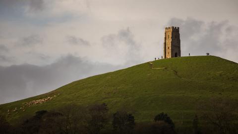 Hikers at Glastonbury Tor on top of the hill