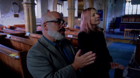 Tony McMahon and Professor Alice Roberts talking inside a church