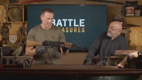 Foxy and Bruce inspecting an AK-47