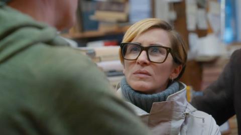 Vicky McClure looks at a man who has his back to the camera while she listens to what he is saying