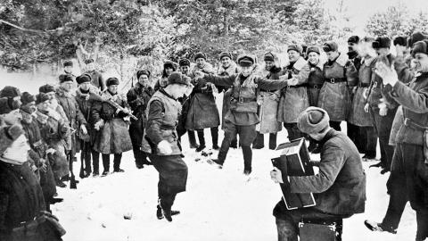 Soviet soldiers dance in the snow to celebrate a successful counteroffensive