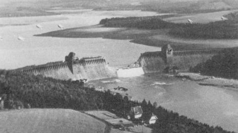 Photograph of the breached Möhne Dam showing the extent of the flooding