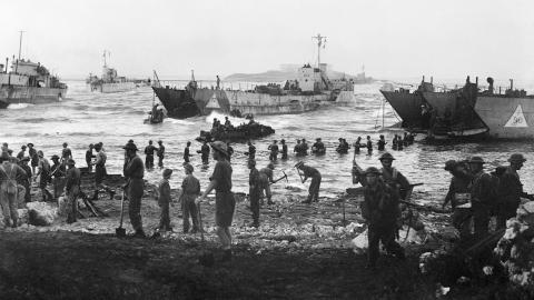 Troops from 51st Highland Division unloading stores from tank landing craft on the opening day of the Allied invasion of Sicily, 10 July 1943