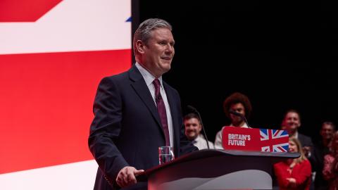 Sir Keir Starmer speaks at the Labour Party Conference in October 2023 while standing at a podium that says, 'Britain's Future'