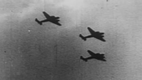 Black and white photograph of planes flying during WWII