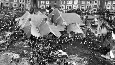Aerial image of rescuers searching for survivors at the school