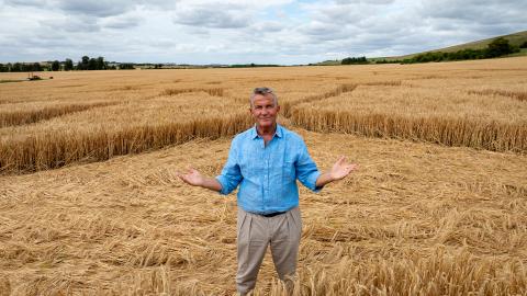 Bradley Walsh standing in a crop circle