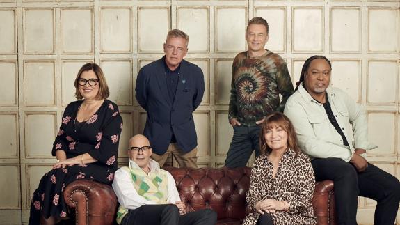 Liza Tarbuck, Harry Hill, Suggs, Chris Packham, Lorraine Kelly and Reginald D Hunter pose around a sofa