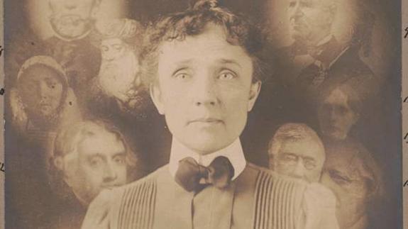 A 'Spirit' photograph, in which a woman is surrounded by ghostly faces, supposedly of the dead