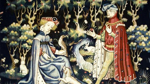 Detail of an early 15th century tapestry showing a man offering his heart to a lady