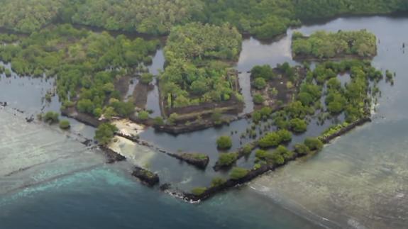 A small man-made island covered in trees