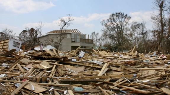 A wide angle shot of the destruction of buildings as a result of a hurricane