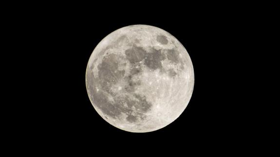 Super full moon with dark background. Madrid, Spain, Europe. Horizontal Photography.