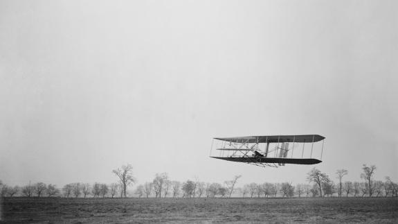 Orville Wright 1871-1948 in flight over treetops covering a distance of approximately 1 760 feet in 40 1/5 seconds at Huffman Prairie Dayton Ohio. November 16 1904.