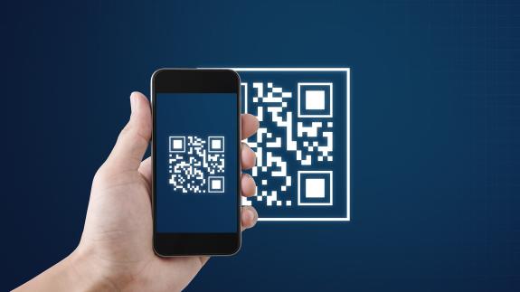 QR code scanning payment and verification. Hand using mobile smart phone scan QR code