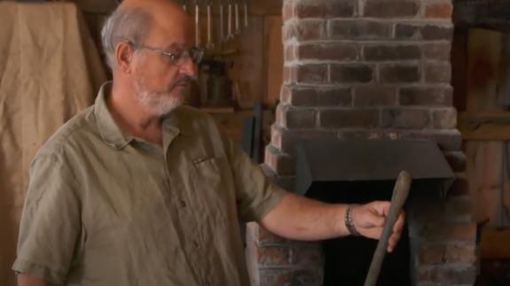 A man holding a large ring bolt