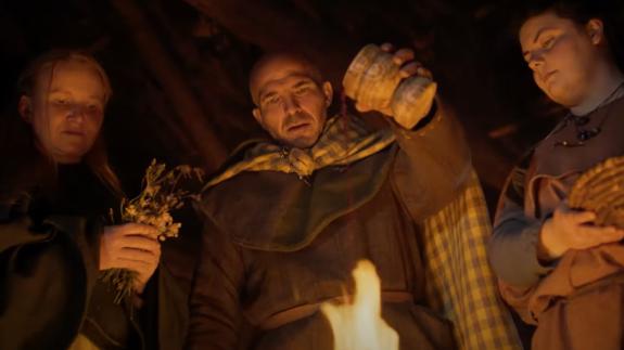 Celts pouring a red liquid onto a fire