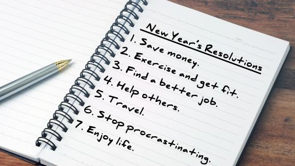 A notepad listing various new year's resolutions