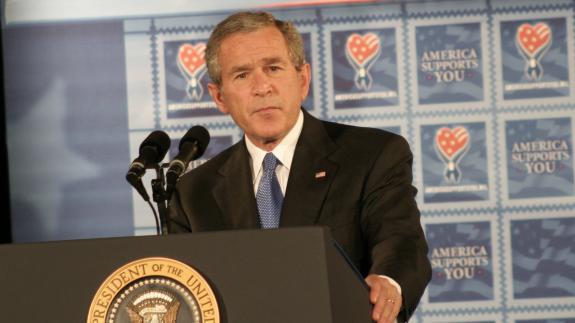 A photograph of President Bush giving a speech