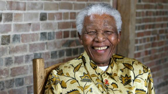 South African president Nelson Mandela smiles as he poses for a portrait in London, 2006
