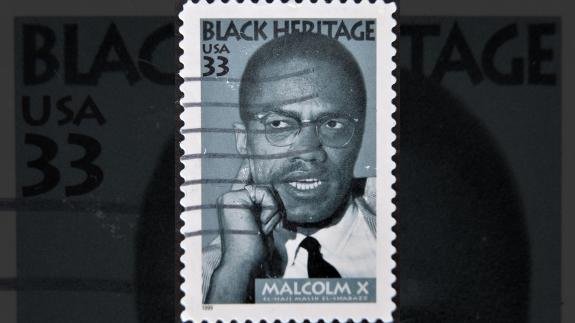 An American postal stamp from 1999, showing Malcolm X