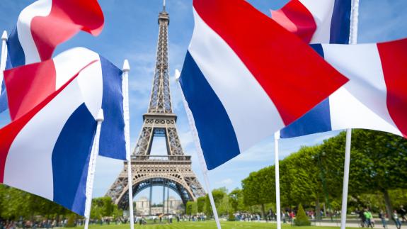 French flags in front of the Eiffel Tower