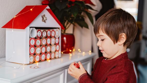 A child opening an advent calendar