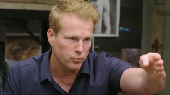 Travis Taylor pointing at the screen