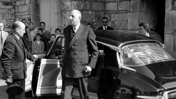 President Charles de Gaulle steps out of a black car not longer his assassination attempt