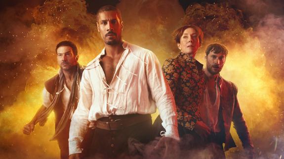 The characters from 'Gunpowder Siege' standing in front of a large explosion