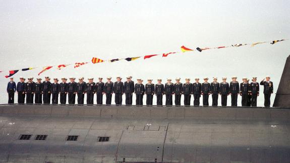 Crew members of the Kursk stand on its deck during a parade in July 2000
