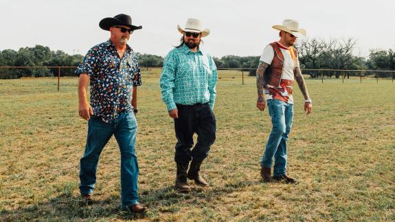The Pawn Stars team dressed in cowboy hats 