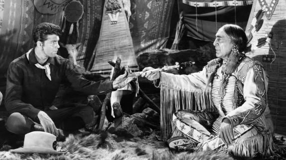Still from the 1954 film 'Sitting Bull' showing Sitting Bull sitting with Robert Parrish