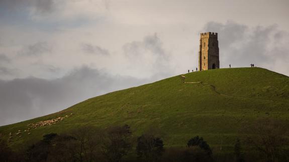 Hikers at Glastonbury Tor on top of the hill