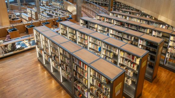 Rows of books in the University House Alexandria Library
