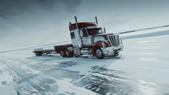 A large truck on a vast ice road