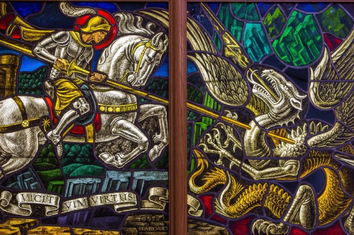 Stained glass window of St George slaying the dragon