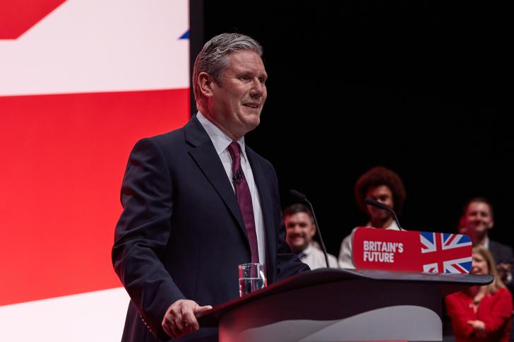 Sir Keir Starmer speaks at the Labour Party Conference in October 2023 while standing at a podium that says, 'Britain's Future'