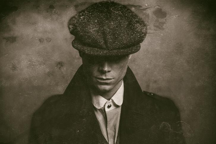 Antique wet plate photo of mysterious 1920s english gangster with flat cap