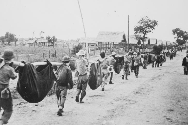 US prisoners using improvised litters to carry those of their comrades who died during the Bataan Death March