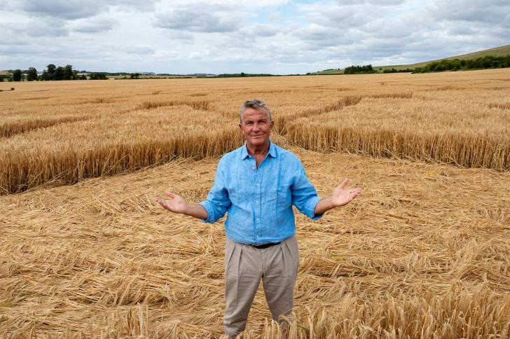 Bradley Walsh standing in a crop circle