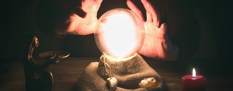 Crystal ball and fortune teller hands. Divination concept. The spiritual seance. Future reading.