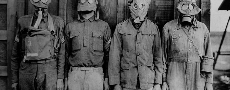 Soldiers wearing WW1 gas masks