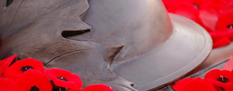 A WW1 helmet on poppies