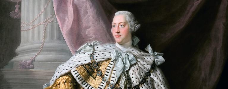 Painting of King George III in white wig and coronation robes