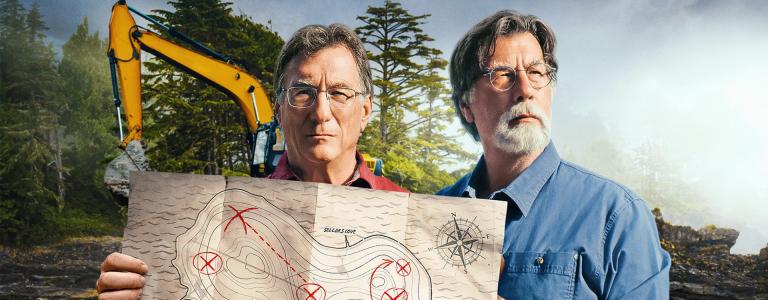 Rick and Marty Lagina holding a map