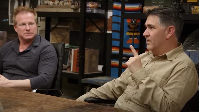 Travis Taylor and Erik Bard sitting at a table