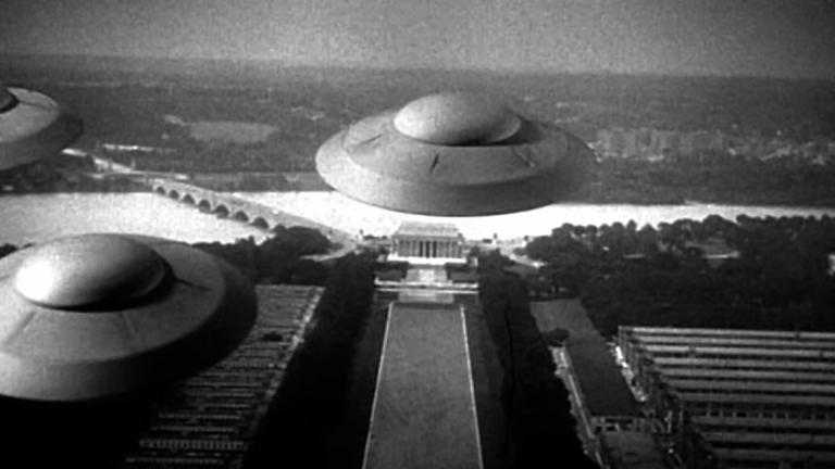 Black and white image of flying saucers hovering over the Lincoln Memorial in Washington DC