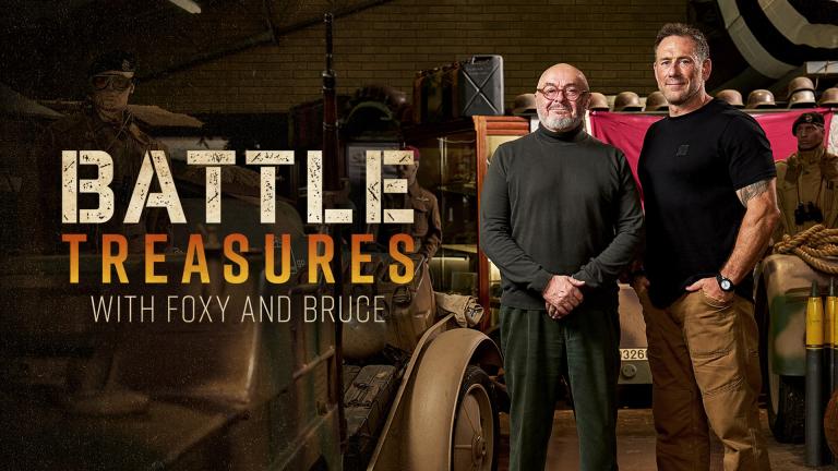 Bruce Crompton and Jason Fox stand next to each other in front of military artefacts
